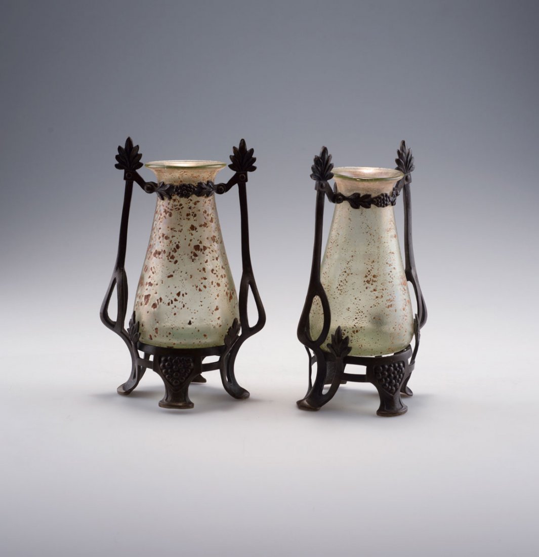 Loetz Wwe., Klostermuhle. Pair of 'Cephalonia m.: Loetz Wwe., Klostermuhle. Pair of 'Cephalonia m. Patinadekor' vases, bronze mounting, 1904. H. 18.2 cm. Pale green glass, fused brownished metal oxides, pale mother of pearl lustre. Bronze mounting wi