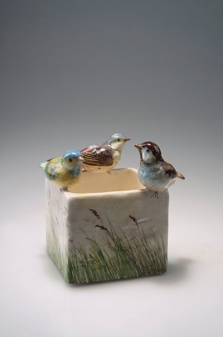 Delphin Massier, Vallauris. Bowl with sparrows, c1900.: Delphin Massier, Vallauris. Bowl with sparrows, c1900. H. 13.6 cm; 14.5 x 13.7 cm. Earthenware, glazed white, polychromatic pattern with grass and birds. Marked: DELPHIN MASSIER, VALLAURIS (A. M.).