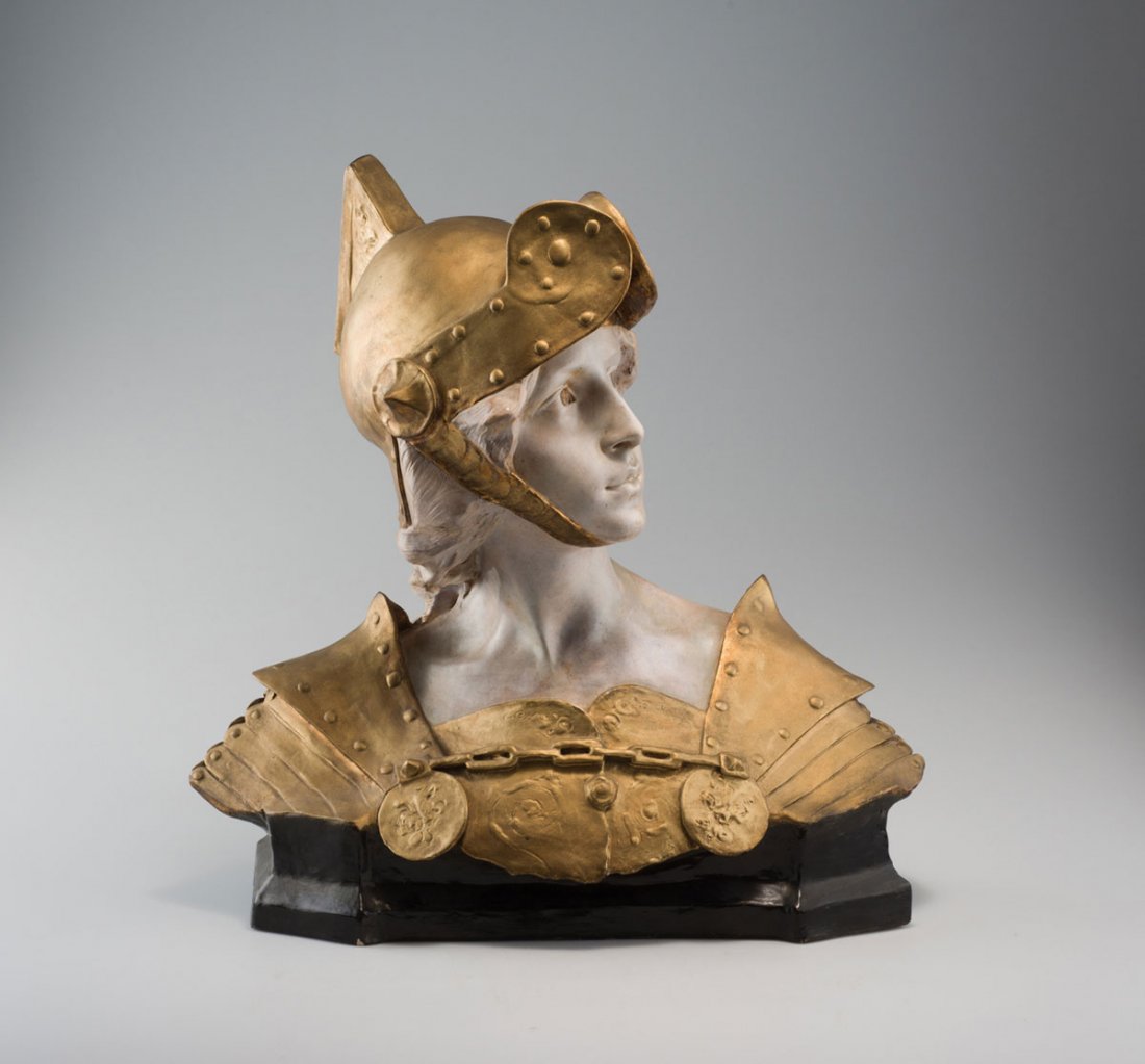 Ezio Ceccarelli. Warrior, c1900. H. 49 cm; 44 x 23 cm.: Ezio Ceccarelli. Warrior, c1900. H. 49 cm; 44 x 23 cm. Made by Friedrich Goldscheider, Vienna (attributed). Faience, glazed white and anthracite grey, golden armour. Marked: Prof. E. Ceccarelli, 2987,