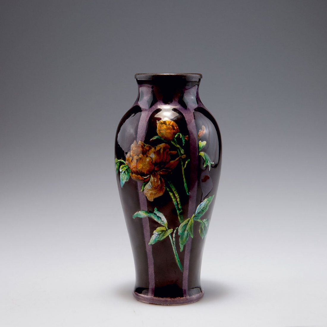Camille Faure, Limoges. Vase, 1920s. H. 18.8 cm. Sheet: Camille Faure, Limoges. Vase, 1920s. H. 18.8 cm. Sheet copper, applied metal foil, enamel, green and orange on purple. Signed inside: C. FAURe Limoges.