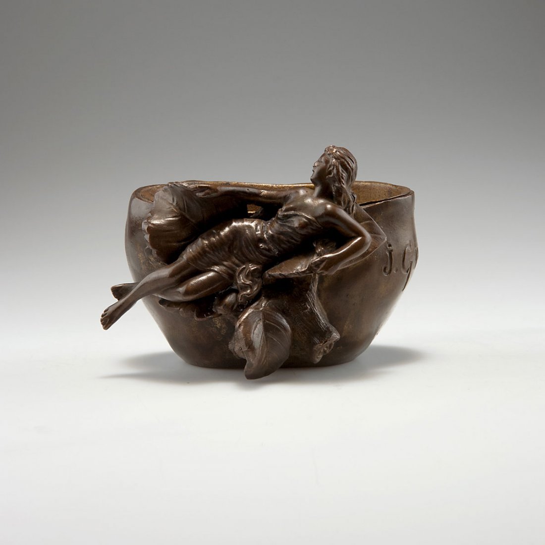 Jean Garnier. Flowerpot, c1890. H. 9.2 cm; 12.5 x 11.5: Jean Garnier. Flowerpot, c1890. H. 9.2 cm; 12.5 x 11.5 cm. Made probably in the 1920s. Cast metal, brown patina. Inside and inset gilt. Marked: J. GARNIER.