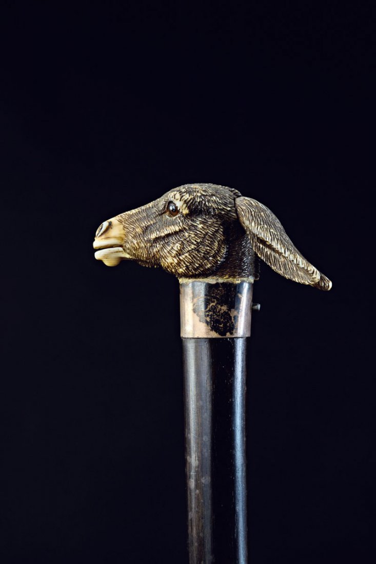 Brigg, London. Mechanical walking stick with donkey's: Brigg, London. Mechanical walking stick with donkey's head, 1898. Carved ivory, part tinted. Ears can be moved, mouth opens, showing a pink tongue. Silver cuff. L. 87.5 cm; handle: H. 3.5 x 2.7 x 6.0