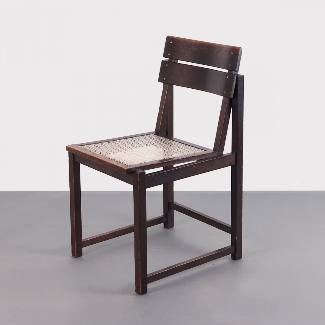 Chair: Erich Dieckmann. Chair, c1926. H. 81 x 43.5 x 52.5 cm. Made at Bauhochschule Weimar (attributed). Elmwood, stained dark, nylon work.