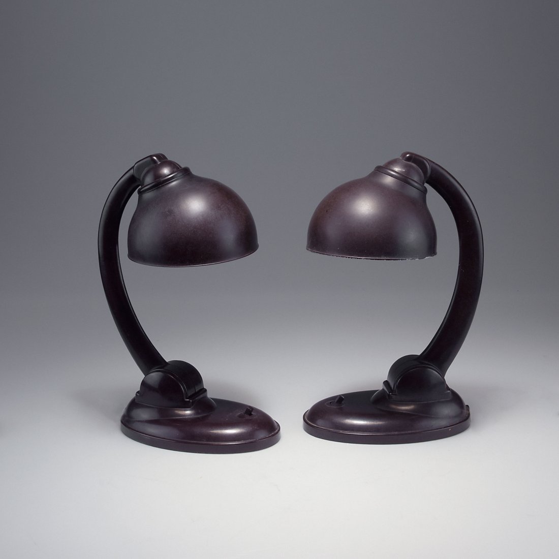 Eric Kirkland Cole. Pair of '11126' table lights,: Eric Kirkland Cole. Pair of '11126' table lights, c1930. H. 35.5-36 cm; D. 16 cm. Made by ESC, England. Bakelite, different shades of brown. Marked: TYP 11126, 250 V 60 W.