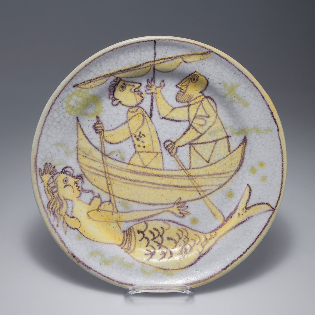 Guido Gambone, Montella. Decorative 'Mermaid' plate,: Guido Gambone, Montella. Decorative 'Mermaid' plate, 1950s. D. 36.5 cm. Earthenware, glazed yellow and purple on white, grey craquelure. Marked: Donkey, GAMBONE ITALY.