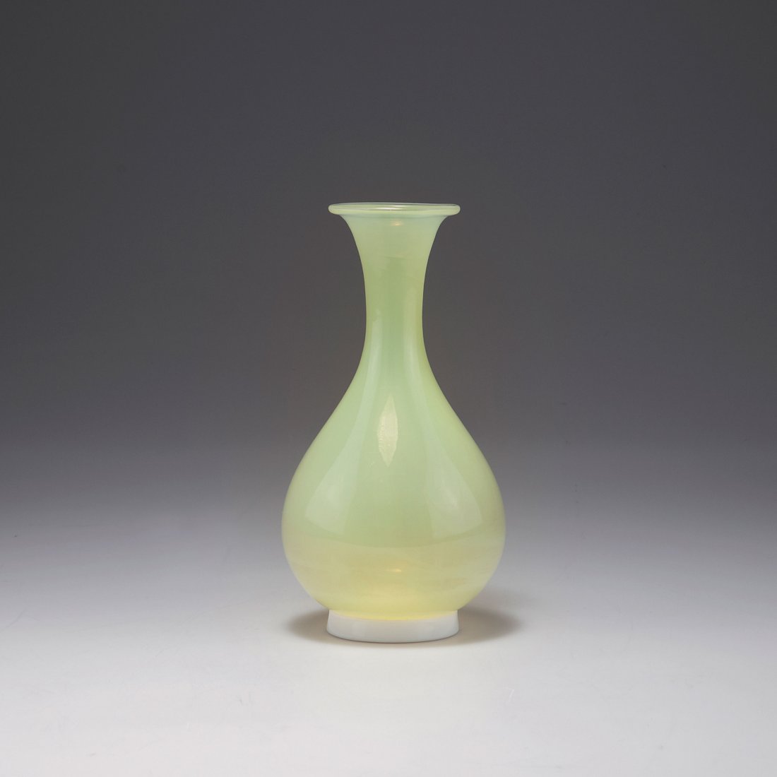 Tomaso Buzzi. 'Incamiciato' vase, c1932. H. 21.6 cm.: Tomaso Buzzi. 'Incamiciato' vase, c1932. H. 21.6 cm. Made by Venini & C. Cased glass, clear and yellow, white foot. Marked: venini murano ITALIA (acid stamp).
