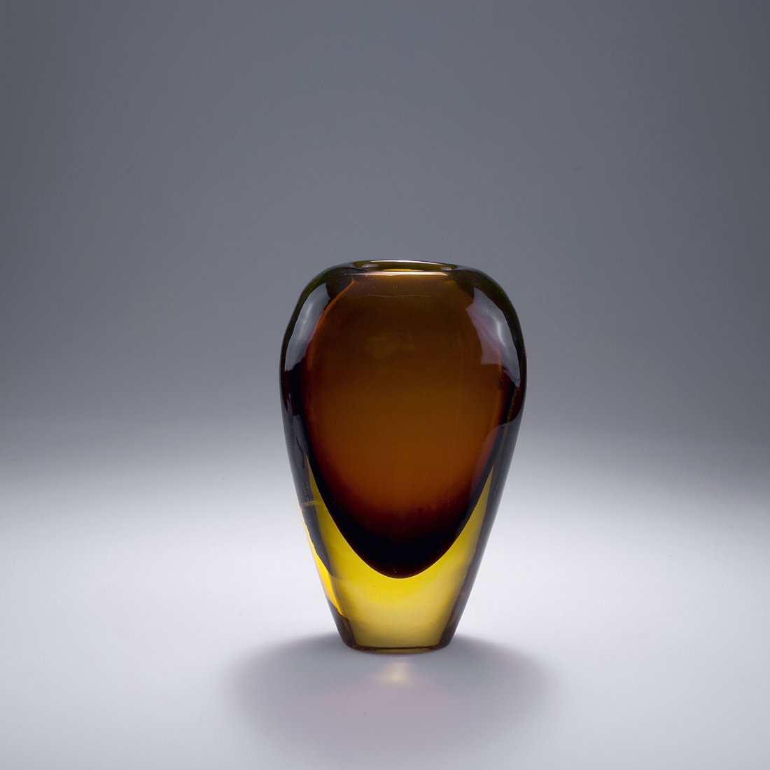Flavio Poli. 'Sommerso' vase, c1955. H. 30 cm. Made by: Flavio Poli. 'Sommerso' vase, c1955. H. 30 cm. Made by Seguso Vetri d'Arte. Cased glass, clear, yellow and brown.