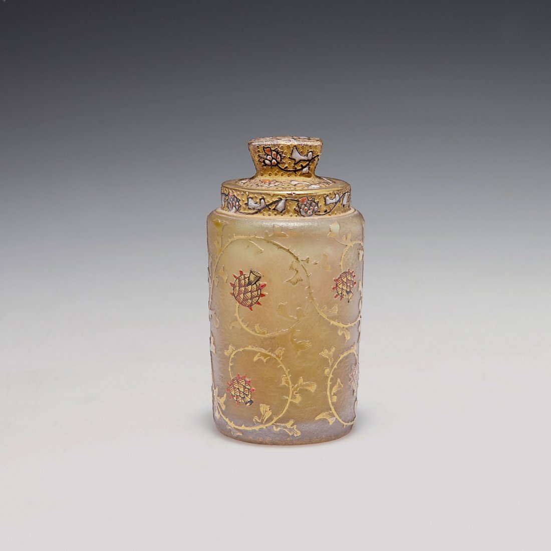 'Chardons de Lorraine' flacon and stopper: Daum Freres, Nancy. 'Chardons de Lorraine' flacon with stopper, 1896-98. H. 7.4 cm. Cased glass, clear and pale amber, etched, gilded and enamelled. Grisaille paint. Thistles. Red and white enamel. Ro