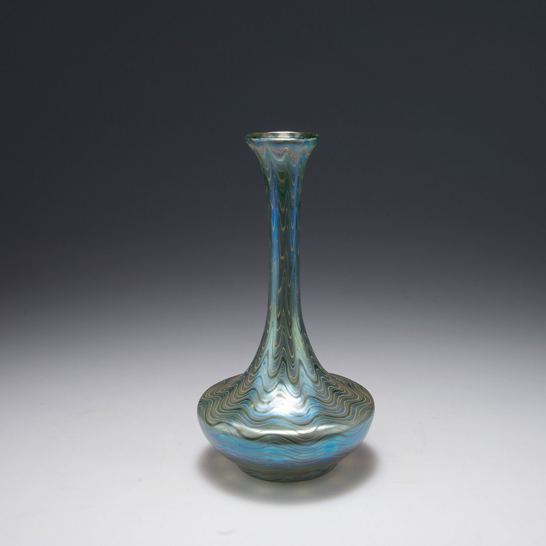 'Phaenomen' vase: Loetz, Klostermuehle. 'Phaenomen' vase, 1899. H. 24.6 cm. Cased glass, blue and clear, combed silver yellow threads, Phaenomen Gre 7506, matt mother of pearl lustre. Signed: Loetz Austria.