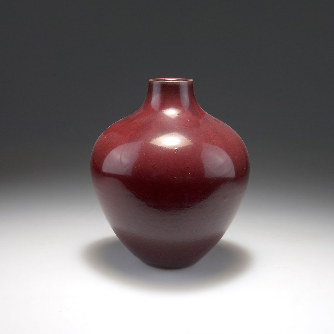 Vase: Royal Copenhagen. Vase, c1926. H. 21.7 cm. Designed by Carl Halier (probably). Made past 1923. Stoneware, dark red high firing glaze. Marked: ROYAL COPENHAGEN DENMARK, waves, artist's signet.
