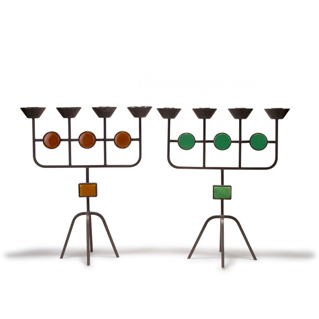 Gunnar Ander. Two candlesticks, 1950s. H. 33 cm; L.: Gunnar Ander. Two candlesticks, 1950s. H. 33 cm; L. 28.5 cm. Made by Ystad Metall. Metal, painted black, amber and green glass.