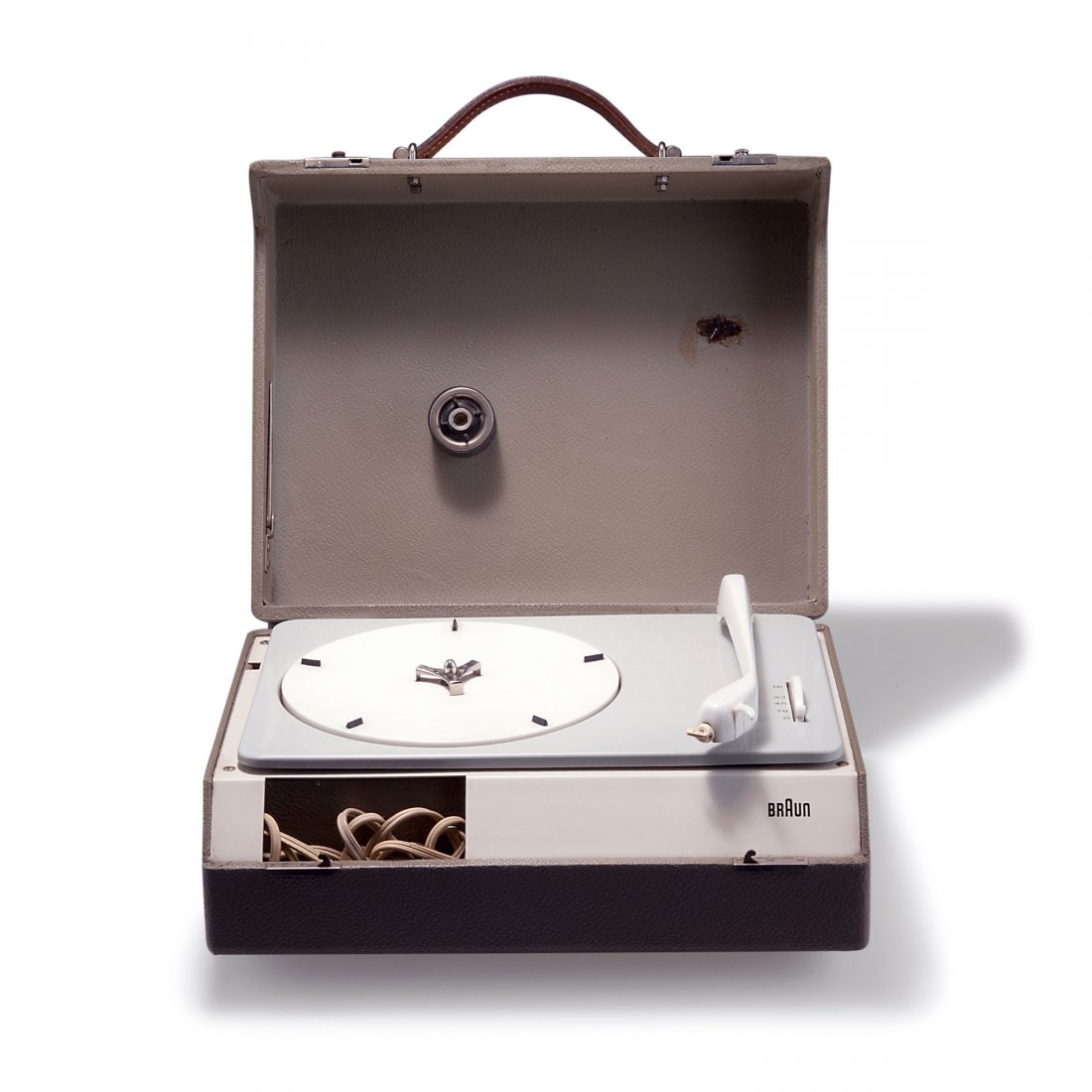 Dieter Rams; Wilhelm Wagenfeld. Portable 'PC 3 SV': Dieter Rams; Wilhelm Wagenfeld. Portable 'PC 3 SV' record player, 1958. H. 13.5 x 33 x 27 cm. Made by Braun AG, Frankfurt/Main. Sheet metal, plastic, white and pale grey, grey leatherette. Marked: Bra