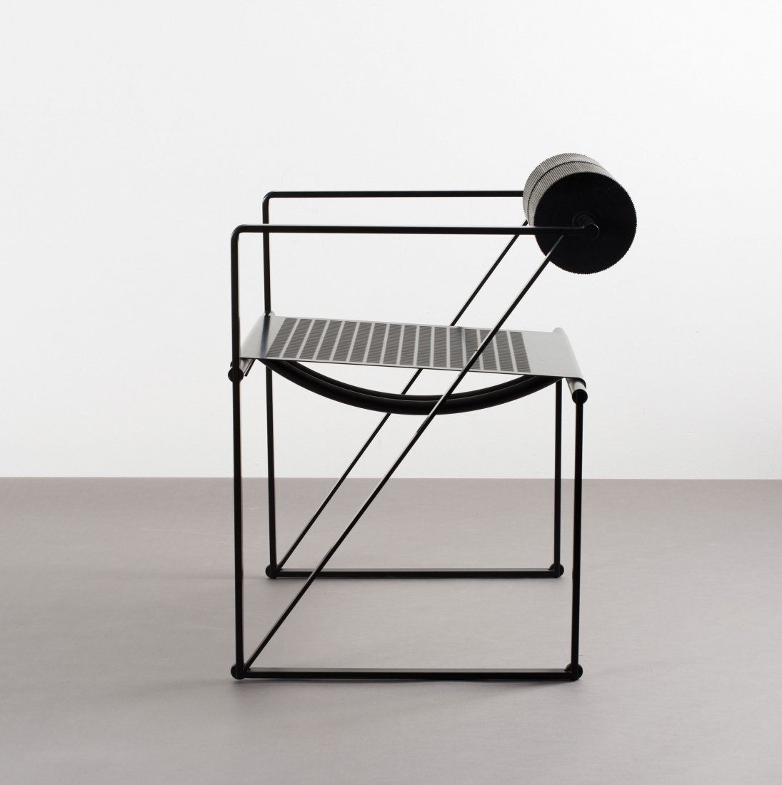 Mario Botta. 'Seconda 602' armchair, 1982. H. 72 x 52 x: Mario Botta. 'Seconda 602' armchair, 1982. H. 72 x 52 x 56 cm. Made by Alias, Crumello del Monte. Tubular steel, sheet steel, black, perforated, riveted, black polyurethane. Marked: Maker's mark.