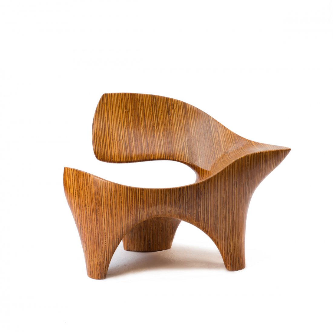 David Delthony. Chair, c1985. H. 72 x 100 x 76 cm.: David Delthony. Chair, c1985. H. 72 x 100 x 76 cm. Carved out of a plywood block.
