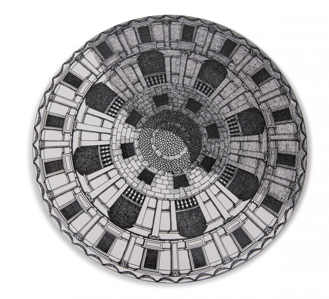 'Architettonico' table top, 2010: Piero Fornasetti. 'Architettonico' table top, 2010. D. 62 cm. Made by Bitossi, Montelupo. Earthenware, glazed white, black print. Marked: Maker's mark.