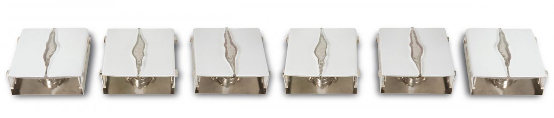 Six sconces, c1960: Venini & C., Murano (attributed). Six sconces, c1960. H. 25 x 26.5 x 9.5 cm. Clear and opal white glass, chrome-plated sheet steel.