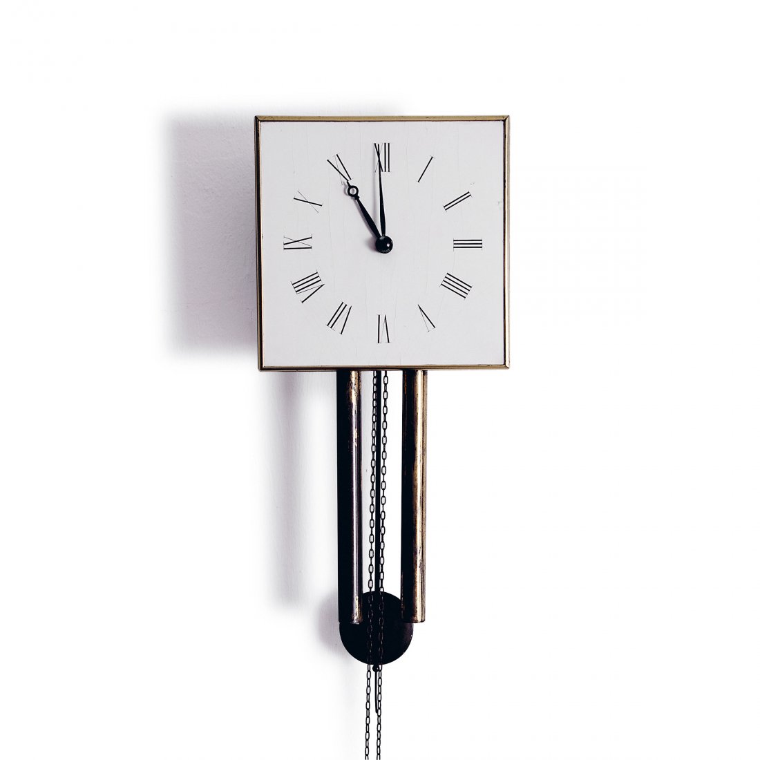 Wall clock, 1910: Heinrich Tessenow. Wall clock, 1910. H. 24.5 x 24.5 x 11.5 cm. Made by Deutsche Werksttten, Dresden-Hellerau. Wood, painted white, vanilla yellow clock face, black roman numerals. Brass frame.