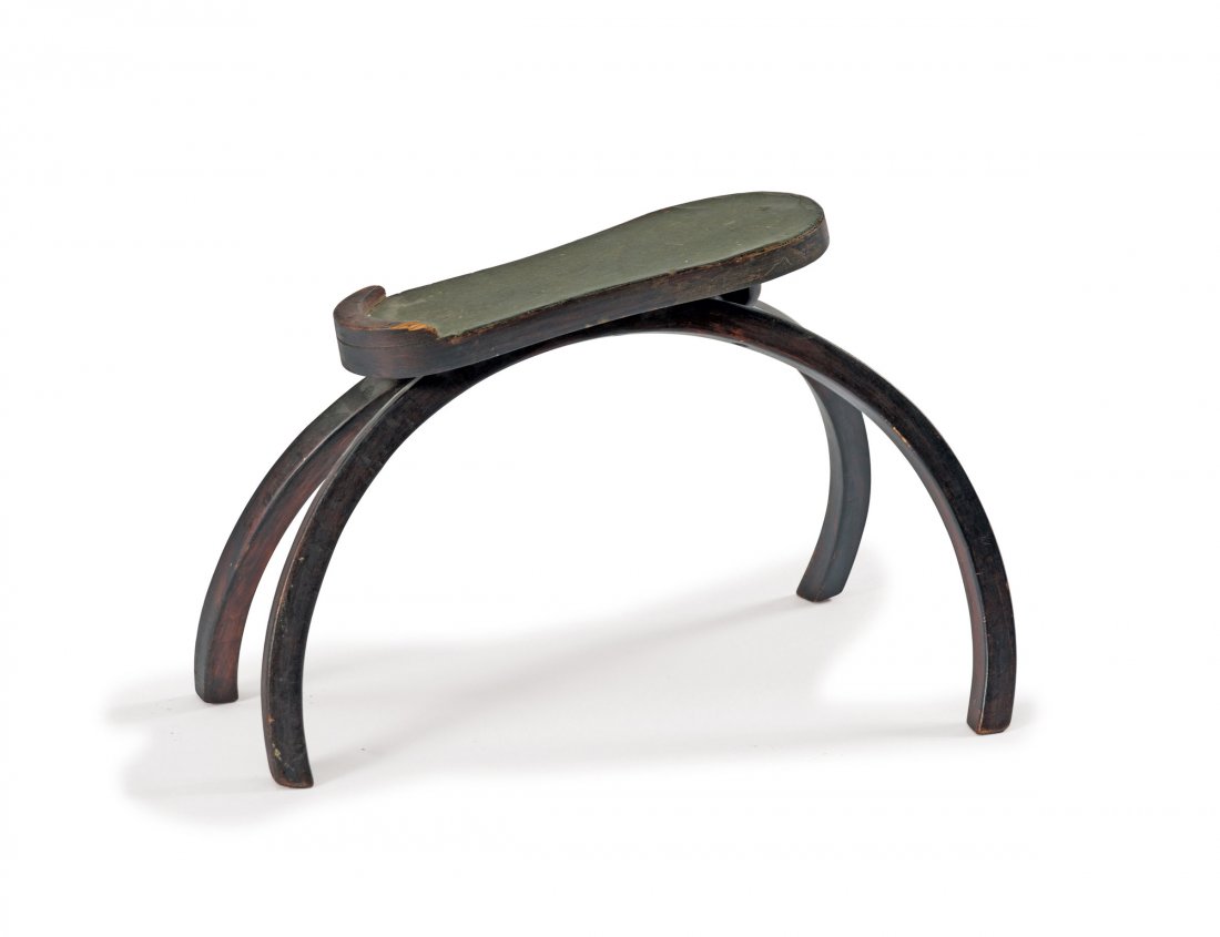 Footstool, c1900: J. & J. Kohn, Vienna. Footstool, c1900. H. 31 cm. Beech bentwood, stained mahogany red. Linoleum.
