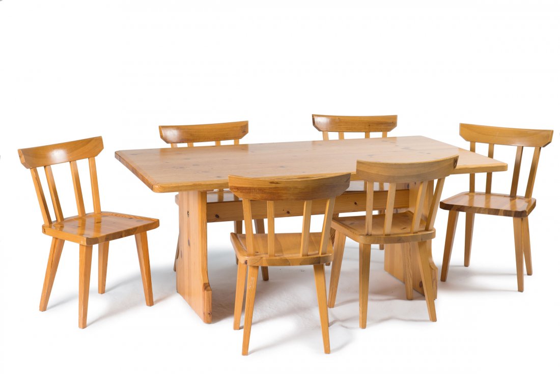 Carl Malmsten. Six chairs and a table, 1960s. Chairs:: Carl Malmsten. Six chairs and a table, 1960s. Chairs: H. 78 x 44.5 x 48 cm; table: H. 70 x 170 x 90 cm. Made by Karl Andersson & Soener, Husqvarna. Pinewood. Marked: Maker's label.