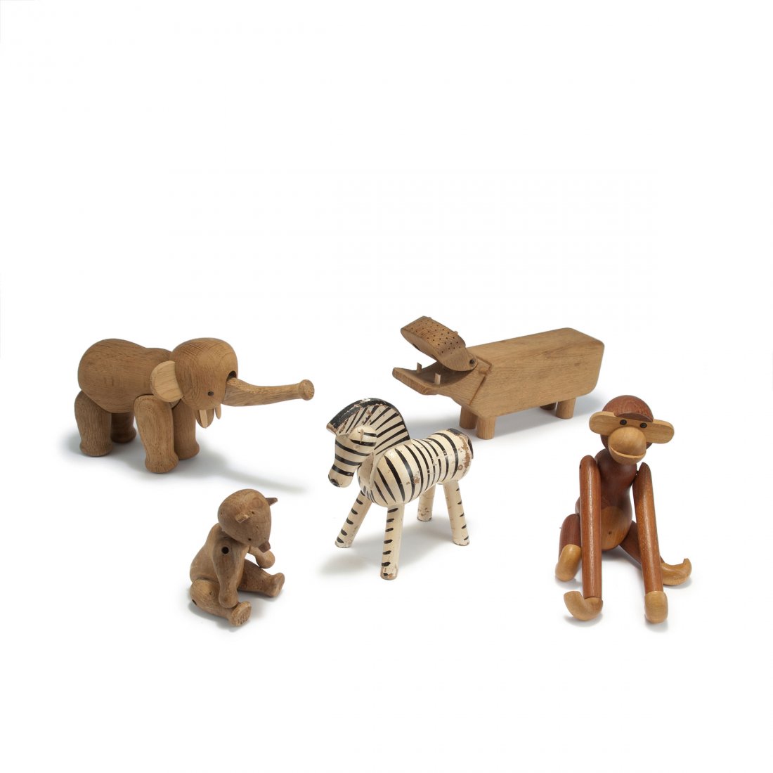 Kay Bojesen. Mixed lot, toy animals, 1935, 1951-55.: Kay Bojesen. Mixed lot, toy animals, 1935, 1951-55. Zebra, monkey, bear, elephant and hippo. H. 10.3-13 cm. Made by Kay Bojesen, Copenhagen. Oak, maple, zebra lacquered b/w. Bear, elephant and hippo w