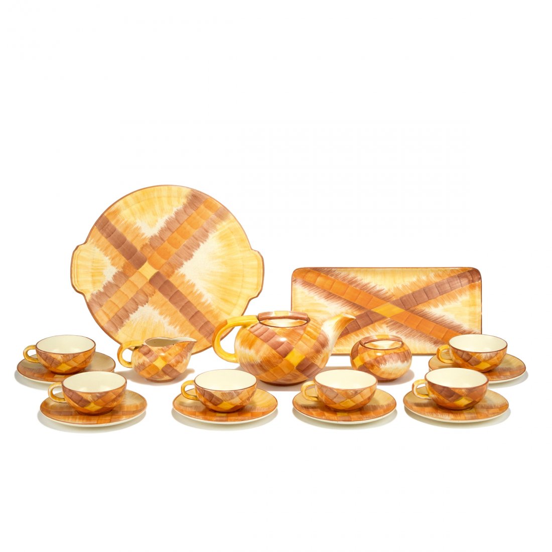 Teaset for six, 1920s: Eva Zeisel-Stricker. Teaset for six, 1920s. 11 pieces. Teapot: H. 11.5 cm; creamer: H. 6.5 cm; sugar bowl: H. 7 cm; 6 cups and saucers: H. .48 cm; two trays: D. 30.7 cm; 34 x 15.5 cm. Made by C. & E.