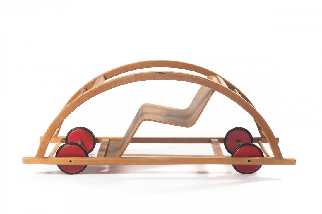 Rocking chair/car, 1950: Hans Brockhage; Erwin Andrae. Rocking chair/Car, 1950. H. 38.5 x 99 x 37.5 cm. Made by Siegfried Lenz, Bergiesshuebel/Pirna. Beech and plywood, red wheels, rubber.