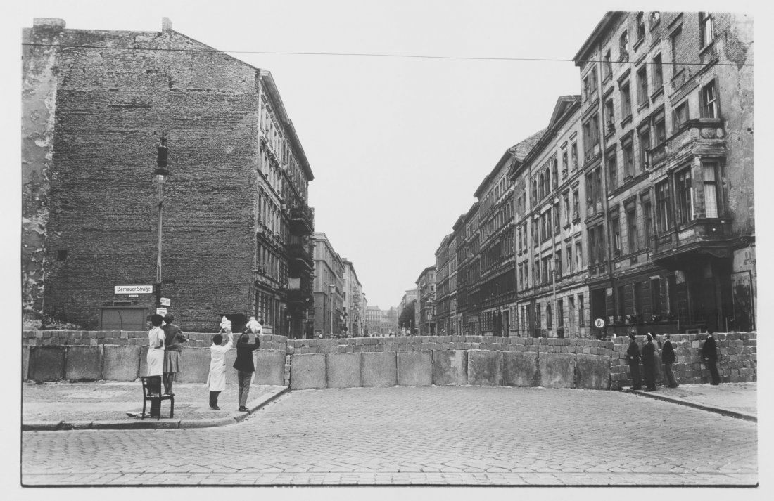 Show babies at the Wall',1961 (later print): Will McBride. 'Show babies at the Wall',1961 (later print). Silver gelatine print on Baryt paper. 49.0 x 61.0 cm (paper). Signed verso: McBride, 1961, Babys zeigen an der Mauer, Berlin (pencil).