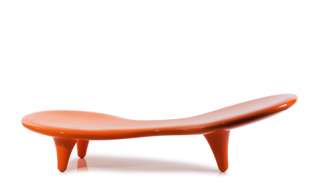 'Orgone' lounge chair, 1989: Marc Newson. 'Orgone Lounge chair', 1998. H. 50 x 75 x 178 cm. Made by Cappellini, Milan. Red/orange plastic reinforced with Fiberglas.