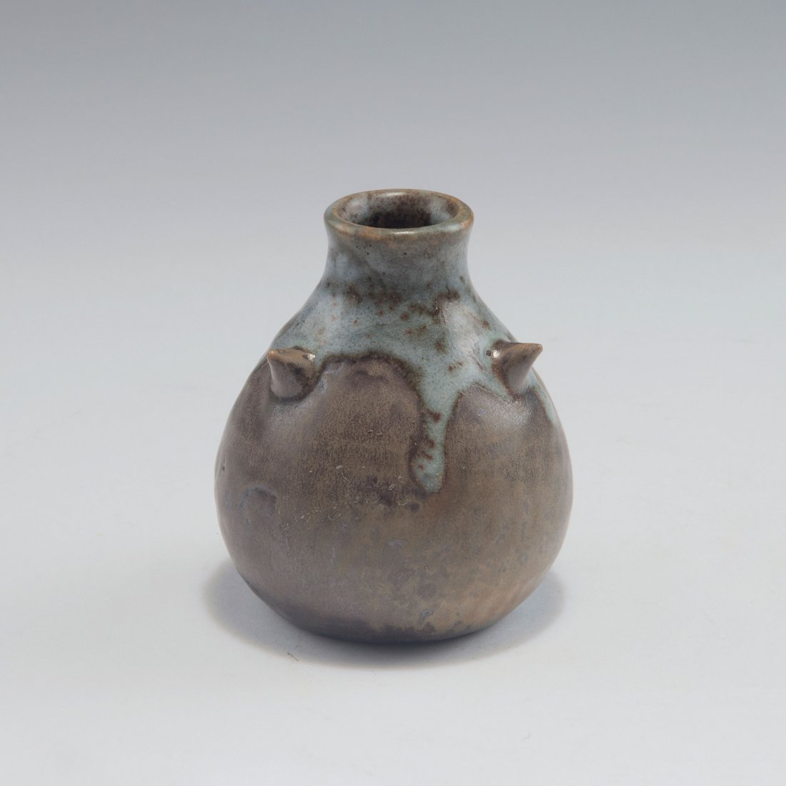 Small vase, c1908: Basile Joseph Theodule Perrot, Arquian. Small vase, c1908. H. 8.7 cm. Stoneware, glazed dark brown, alkali white running glaze. Signed: 242 L, Theo Perrot.