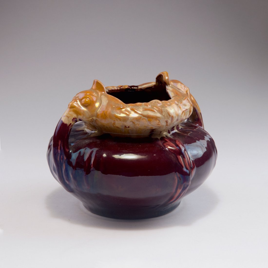 Vase with handles, 1898-99: KPM Berlin. Vase with handles, 1898-99. H. 15.7 cm. Designed by Franz Metzner. Porcelain, white, glazed, red and brown running glaze. Unsigned.