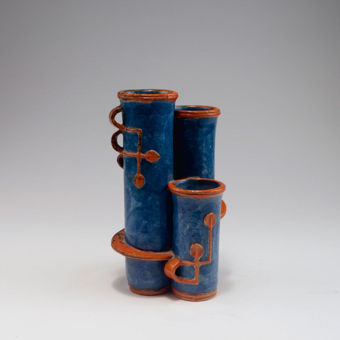 Vase, 1927: Gudrun Baudisch. Vase, 1927. H. 23.5 cm. Made by Wiener Werkstaette. Majolica, glazed blue and orange, textured plant pattern. Marked: WW, MADE IN AUSTRIA, 280, GB.