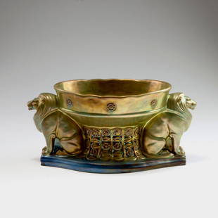 'Lions' centrepiece, 1906-18: Vilmos Zsolnay, Pecs. 'Lions' centrepiece, 1906-18. H. 17 cm, 37 x 18.5 cm. Earthenware, eosin glaze, gold and purple. Marked: Seal, 8636 36.