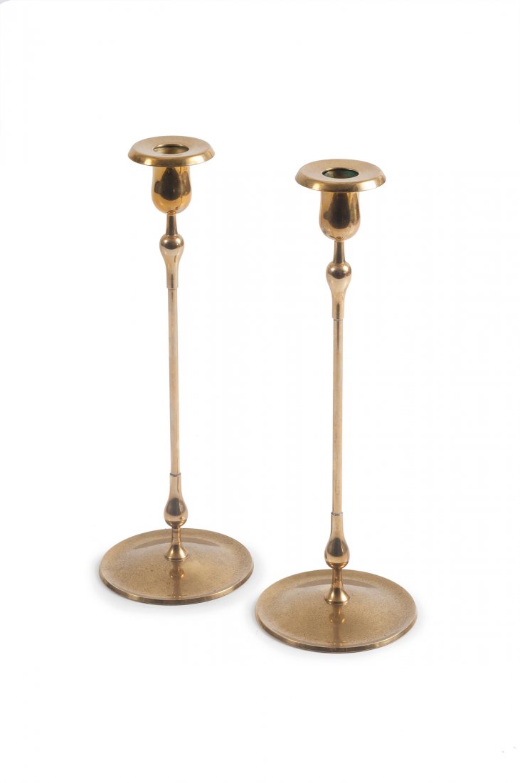 Two candlesticks, c1950: Gunnar Ander. Two candlesticks, c1950. H. 27.5 cm. Made by Ystad Metall, Ystad. Brass. Marked: GA, Ystad Metall MADE IN SWEDEN.