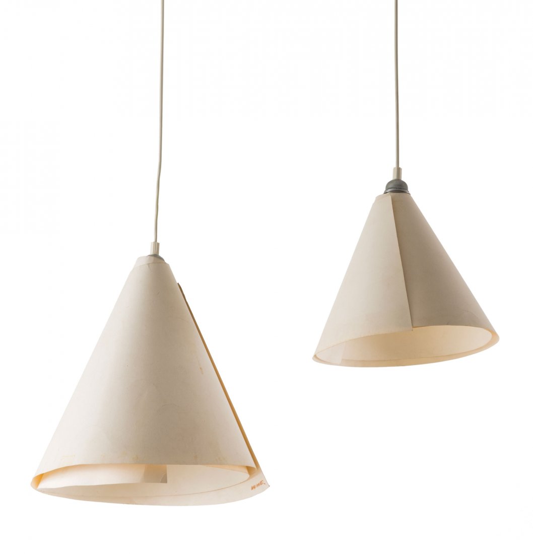Two 'WillyDilly' pendant lights, 1983: Ingo Maurer. Two 'WillyDilly' pendant lights, 1983. H. 24 cm, D. 27.5 cm; H. 32.5 cm, Dm. 32.5 cm. Made by Design M Ingo Maurer, Munich. White cardboard, clamp, wire. Marked: Ingo Maurer.