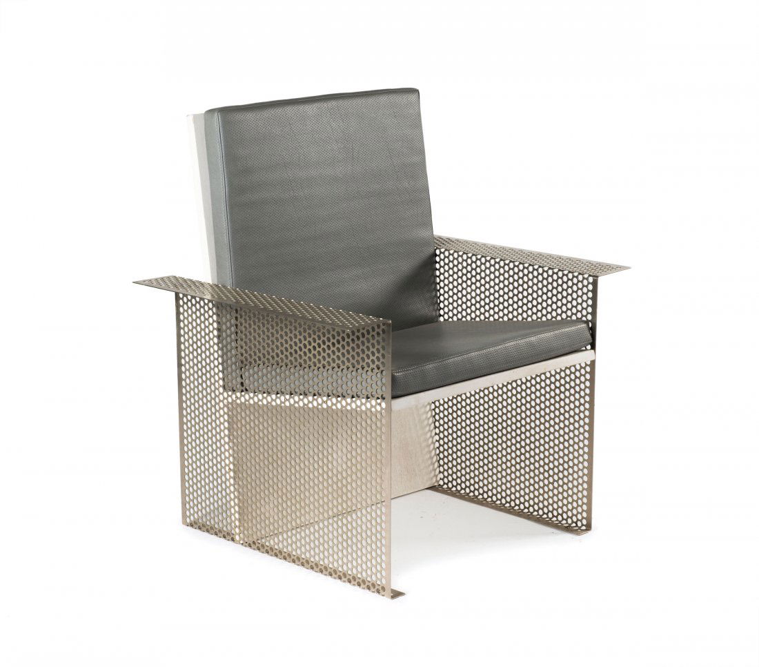 'Qubus' armchair, 1987: Hermann Waldenburg. 'Qubus' armchair, 1987. H. 90.5 x 82.5 x 65 cm. Perforated steel sheet, wood, painted white, grey leatherette. Impressed 'W'.