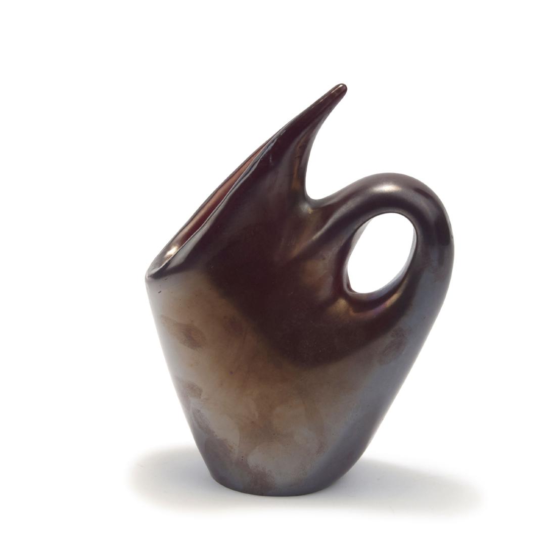 'Anse volante' vase, c1950: Giorgio Ferro. 'Anse volante' vase, c1950. H. 24.5 cm. Made by A.Ve.M. Cased glass, clear and ruby red, iridescent.