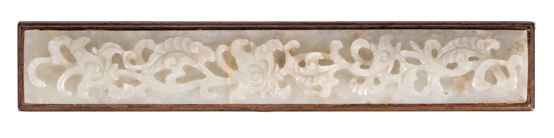 A Chinese hardwood scroll weight, decorated with a (1 of 2)