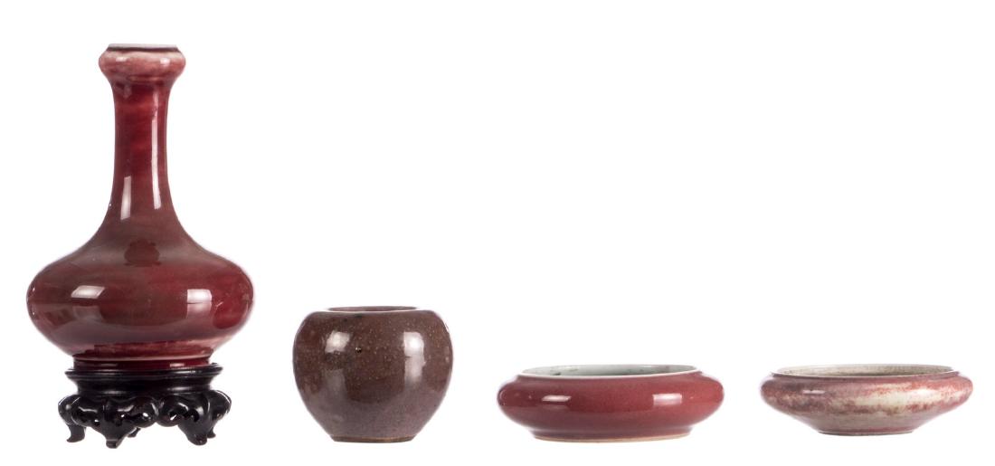 A Chinese sang de boeuf bottle vase on a matching (1 of 10)