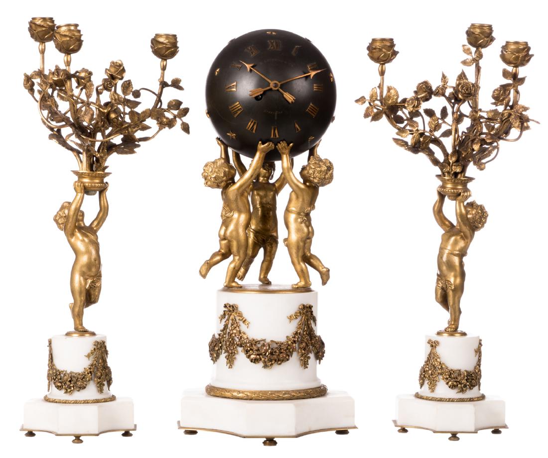 A bronze and patinated bronze garniture on a white (1 of 16)