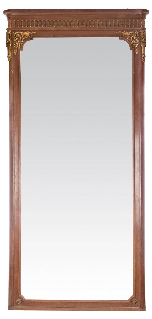A mahogany and bronze mounted wall mirror, probably: A mahogany and bronze mounted wall mirror, probably produced by De Coene - Coutrai,Â H 242 - B 118 cm