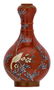 A Chinese orange ground polychrome and gilt decorated