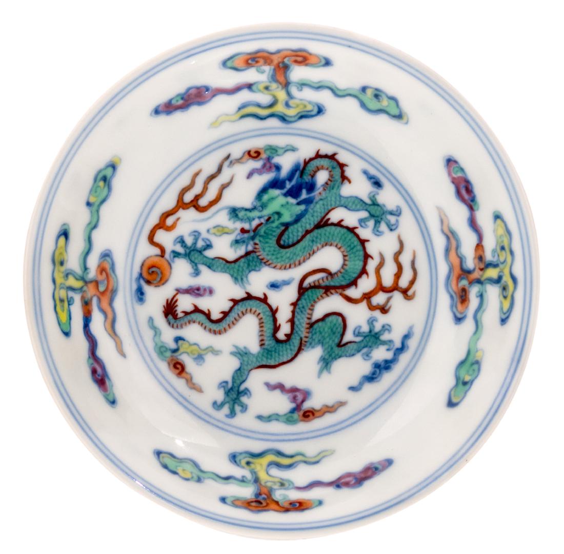 A Chinese doucai dragon decorated saucer, Yongzheng (1 of 2)