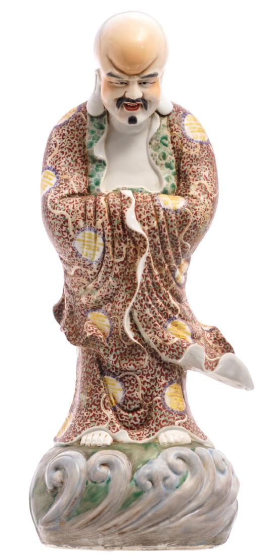 A Chinese polychrome decorated figure of a Lohan (1 of 6)