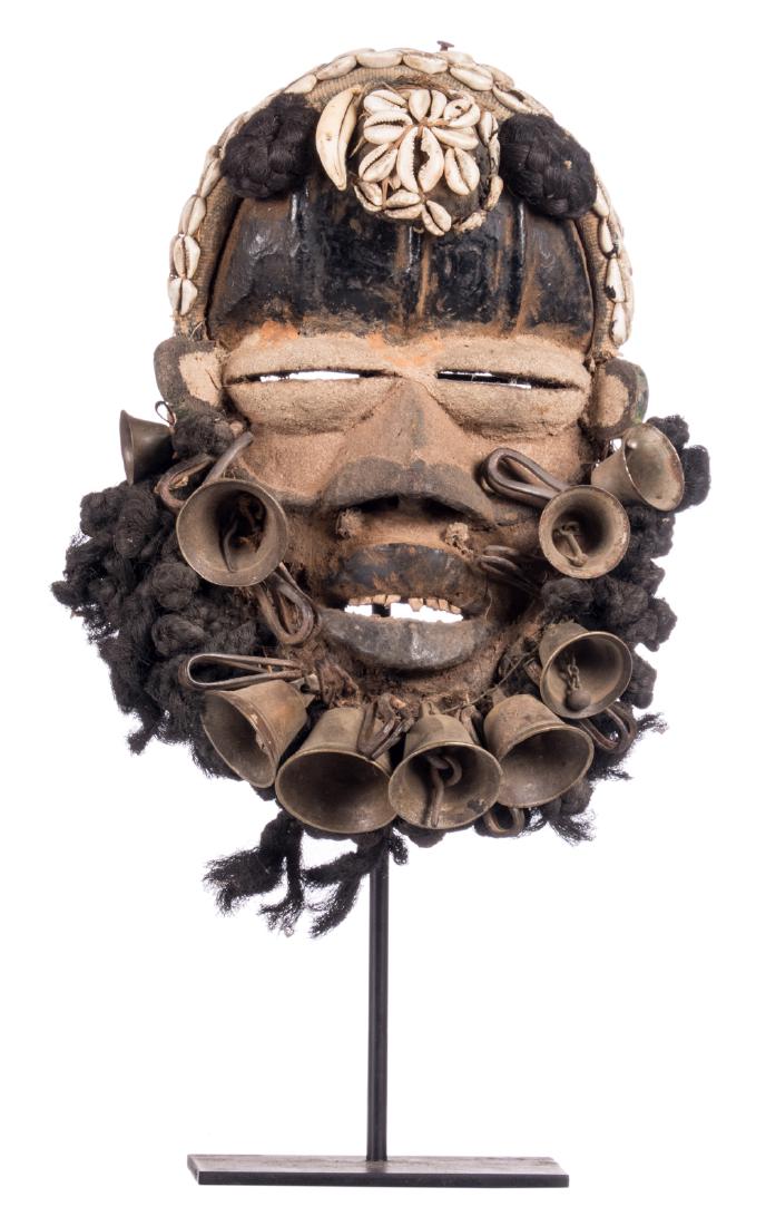 A traditional African wooden mask with shells and (1 of 6)