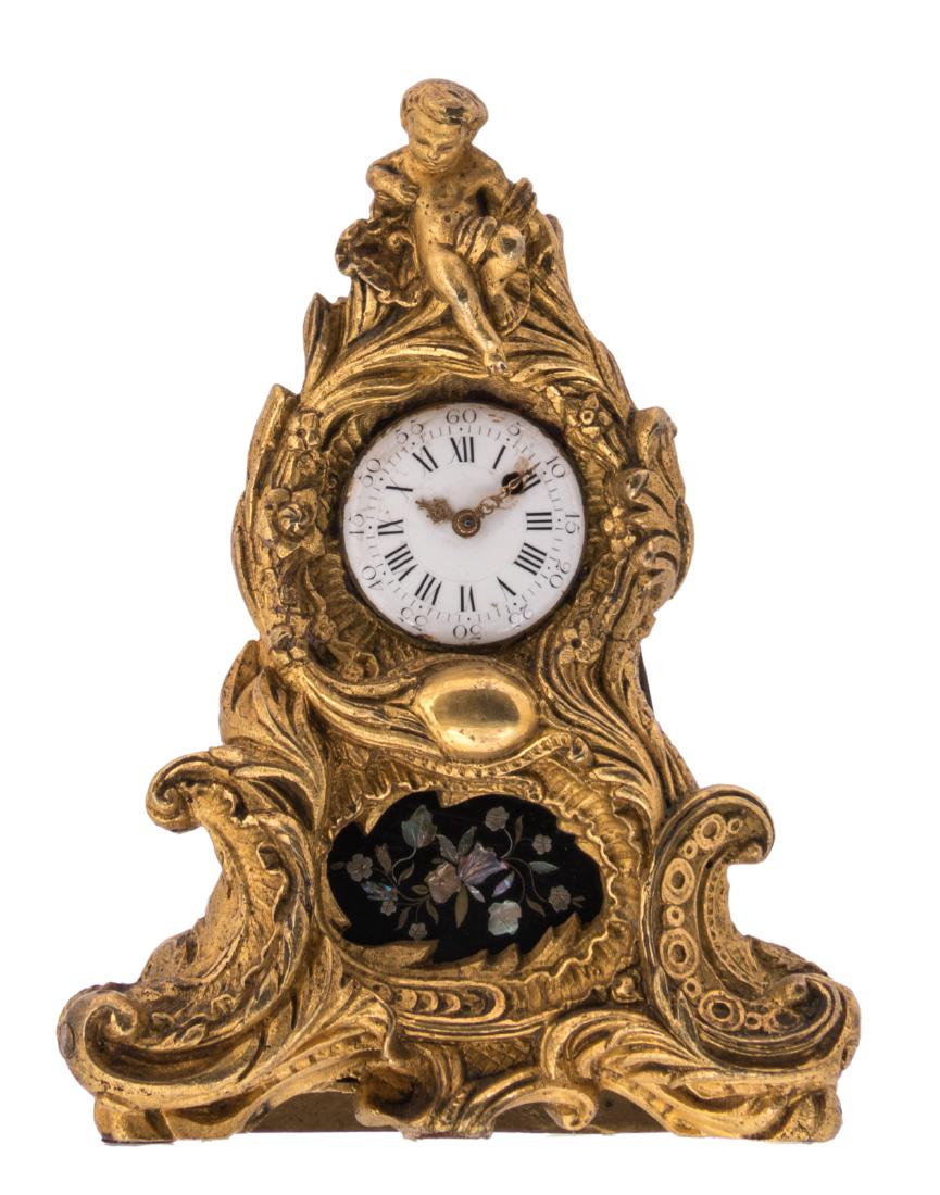 A probably French and 18thC Rococo style table clock, (1 of 8)