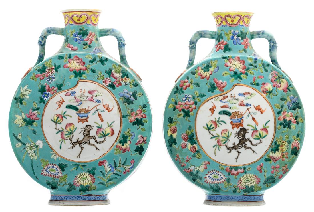 Two Chinese turquoise ground famille rose floral: Two Chinese turquoise ground famille rose floral decorated moon flasks, the roundels with auspicious symbols, H 29,5 cm