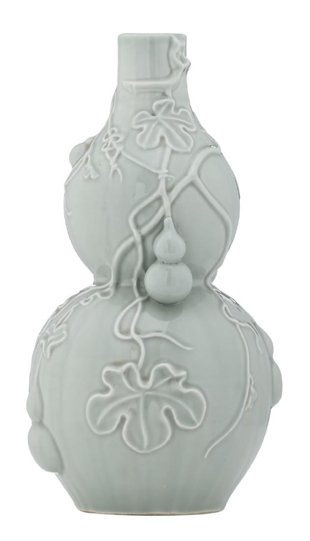 A Chinese celadon ware double gourd vase, relief: A Chinese celadon ware double gourd vase, relief decorated with calabash, H 40 cm