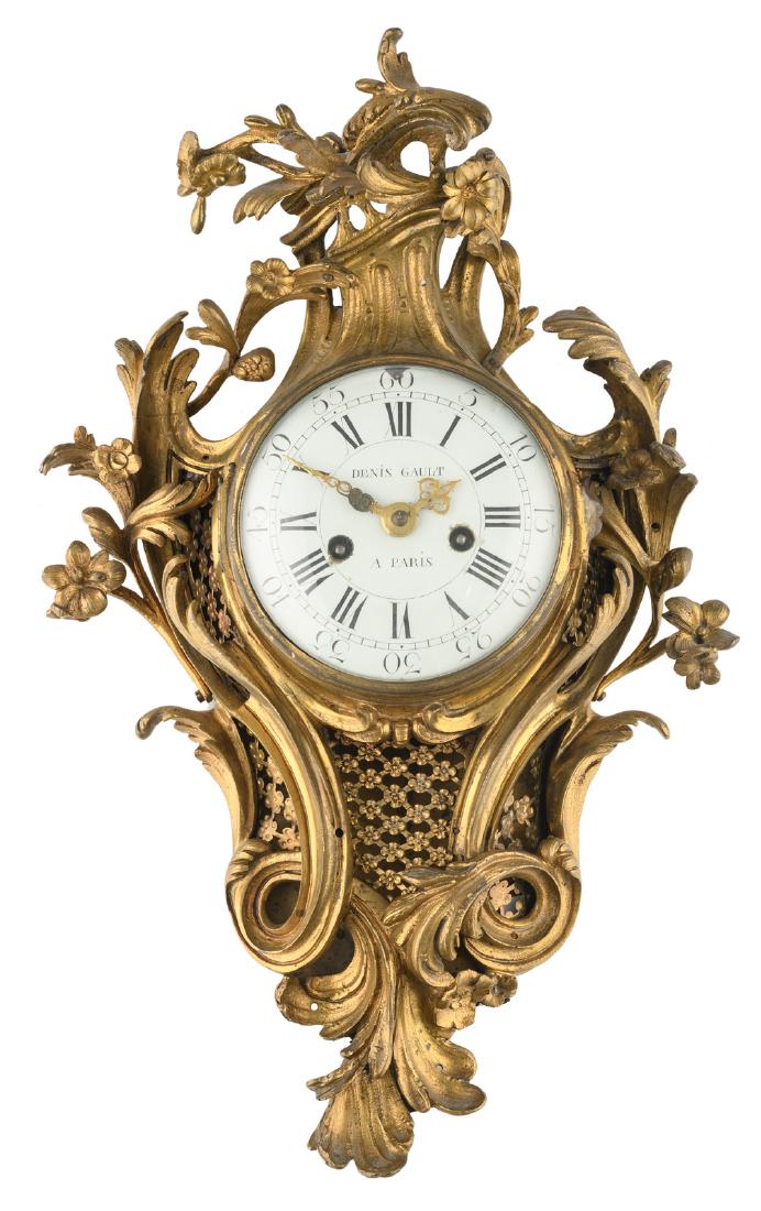 An 18thC gilt brass rococo style clock, the work and: An 18thC gilt brass rococo style clock, the work and the dial marked 'Denis Gault a Paris', ex. Criterion Auctioneers LTD September 2017 (lot 45), H 52 cm