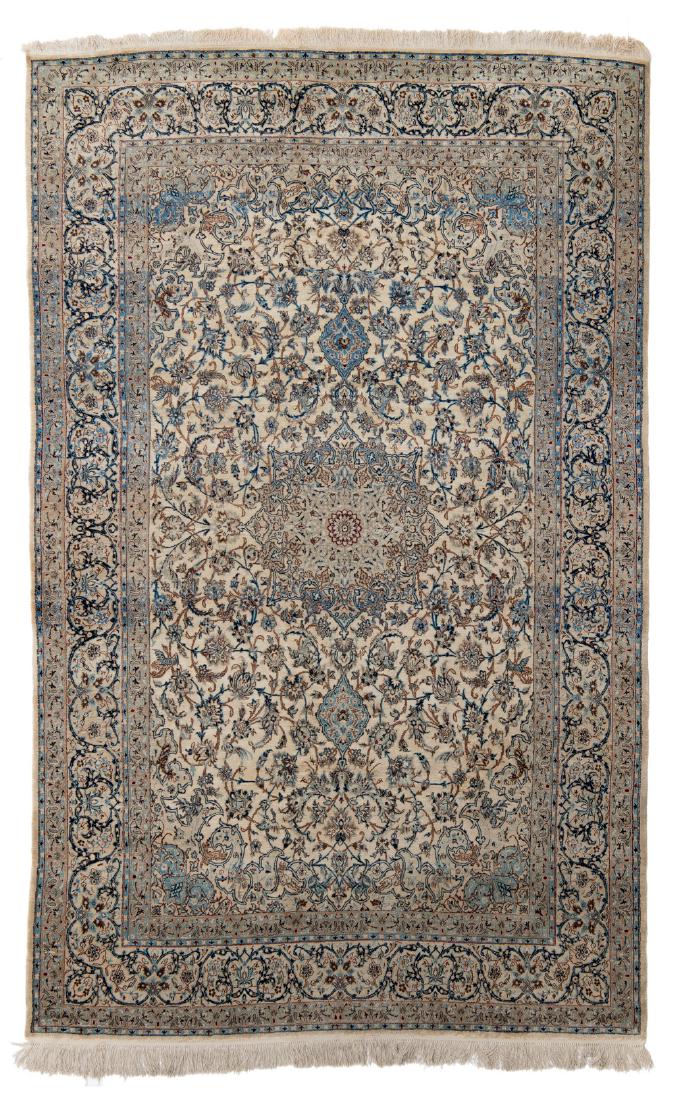 A fine Oriental floral decorated rug, the field with: A fine Oriental floral decorated rug, the field with scrolling flower branches and animals, with a central medallion, Nain, wool and silk on cotton, 197 x 330 cm