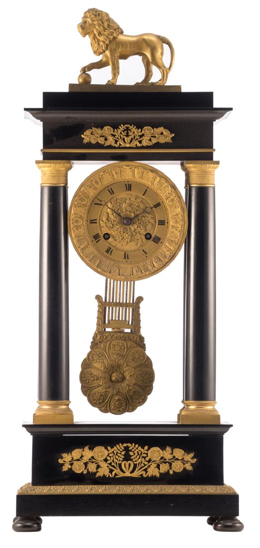 A mid 19thC Neoclassical ebony and ebonized wooden gilt: A mid 19thC Neoclassical ebony and ebonized wooden gilt bronze mounted portico clock, the dial marked 'Ed. Lecerf a Gand', H 62 cm
